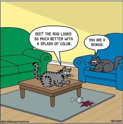 A cat on the table looks down at the spilled red liquid on the  grey rug.
'See, rug looks so much better with a splash of color.'
'You are a genius ', says another cat who's sitting in the chair.